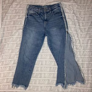 Boyfriend jeans w/ zipper sides. Distressed ends.